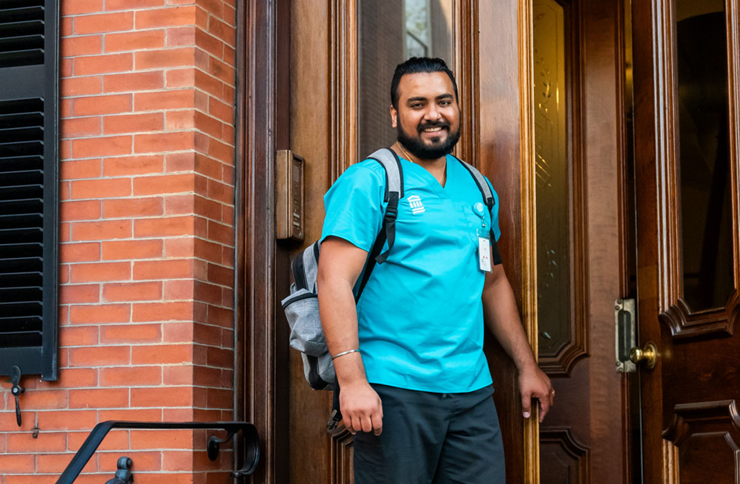 male home care provider outside a patient's home
